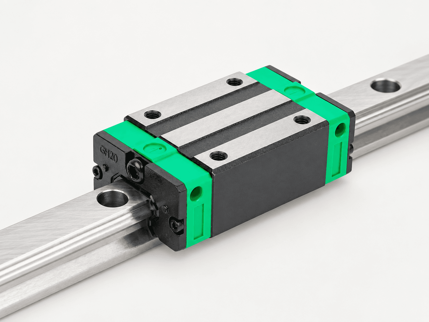 Close-up of a linear guide rail and bearing carriage
