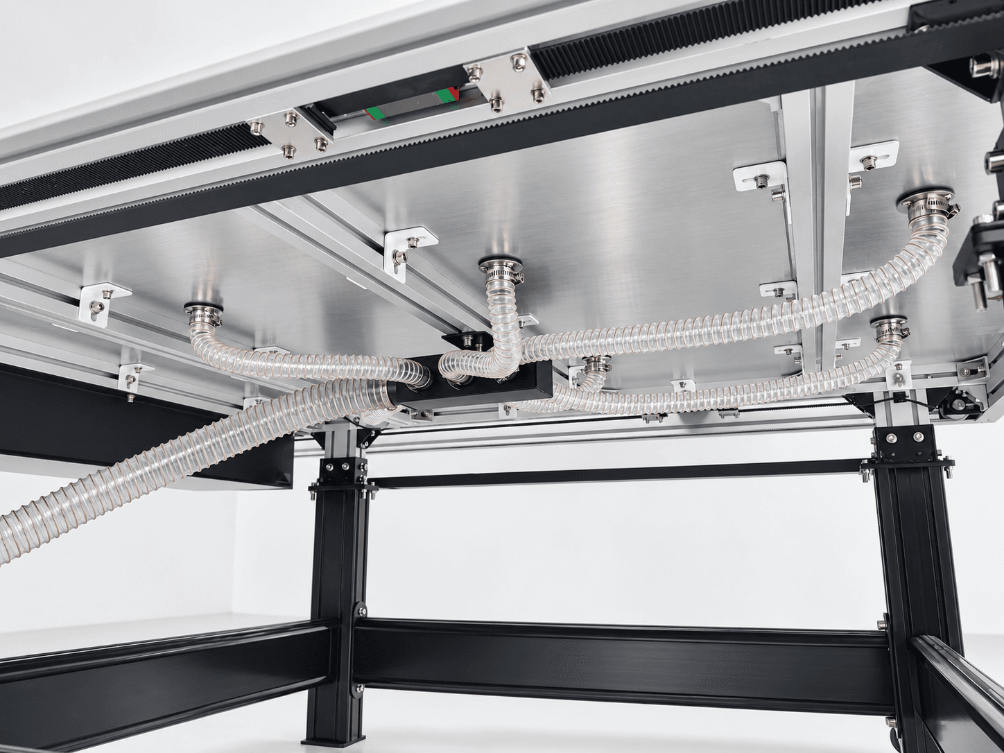 Flatbed Cutting Plotter: vacuum hoses and distribution system beneath the bed